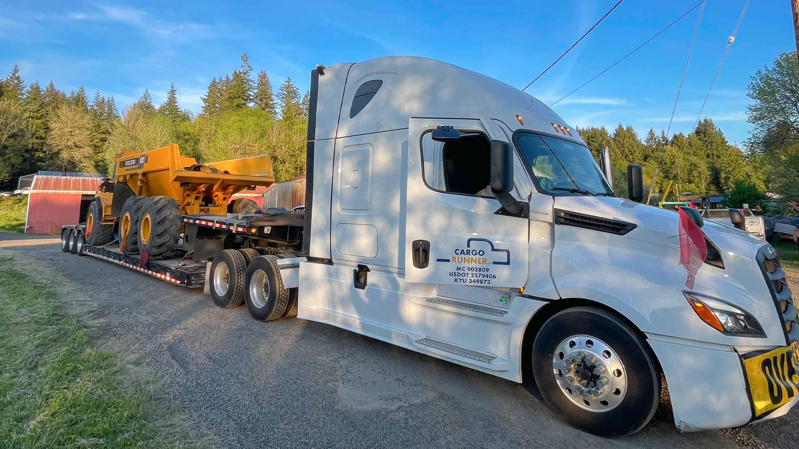 Cargo Runner flatbed transporting heavy equipment